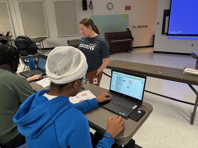 image of student working on laptop