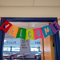 photo of welcome sign in school window